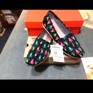 COPY - Size 9 Skechers Bobs multi-colored puppies and dogs on a black sneaker.